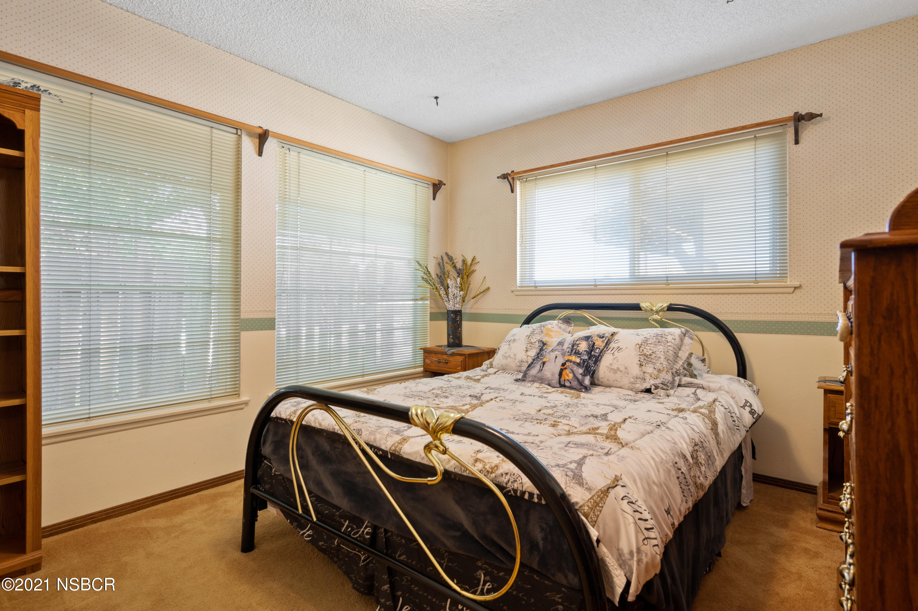 3432 Rucker Road Lompoc, CA 93436 - Photo 13 of 17 a bedroom with a bed and a large window
