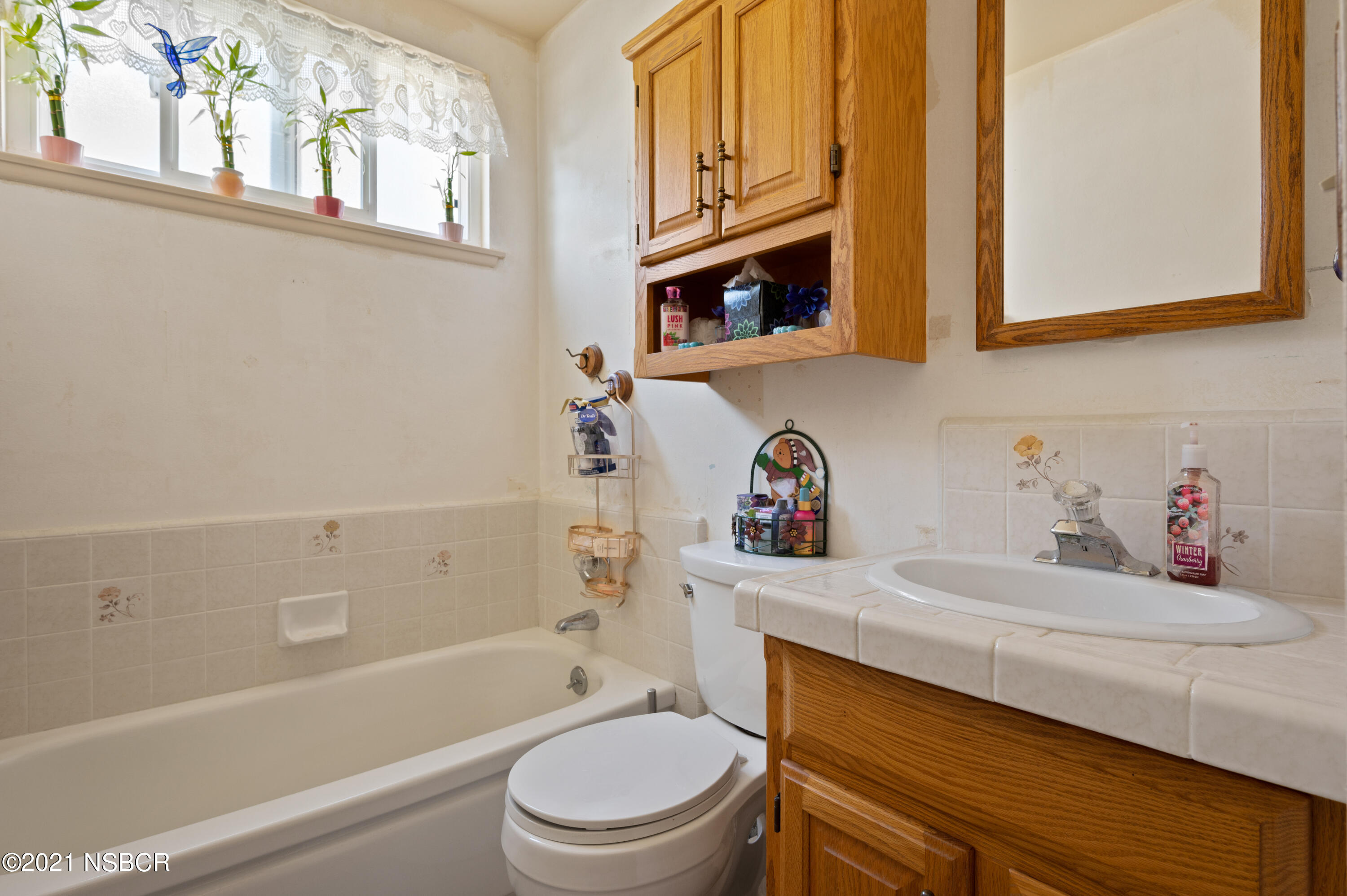 3432 Rucker Road Lompoc, CA 93436 - Photo 14 of 17 a bathroom with a sink toilet vanity granite tub and shower