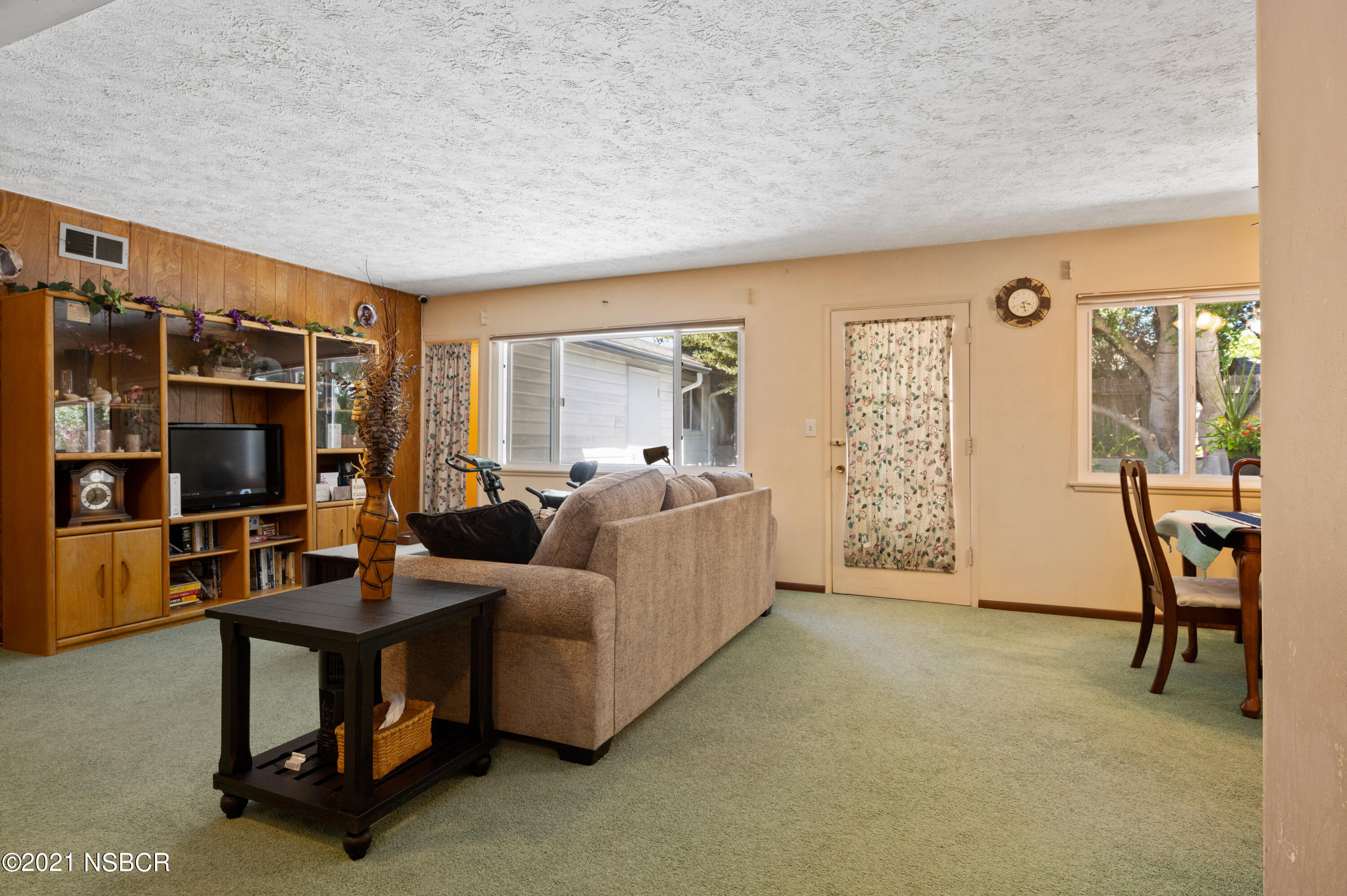 3432 Rucker Road Lompoc, CA 93436 - Photo 3 of 17 a living room with furniture a flat screen tv and a window