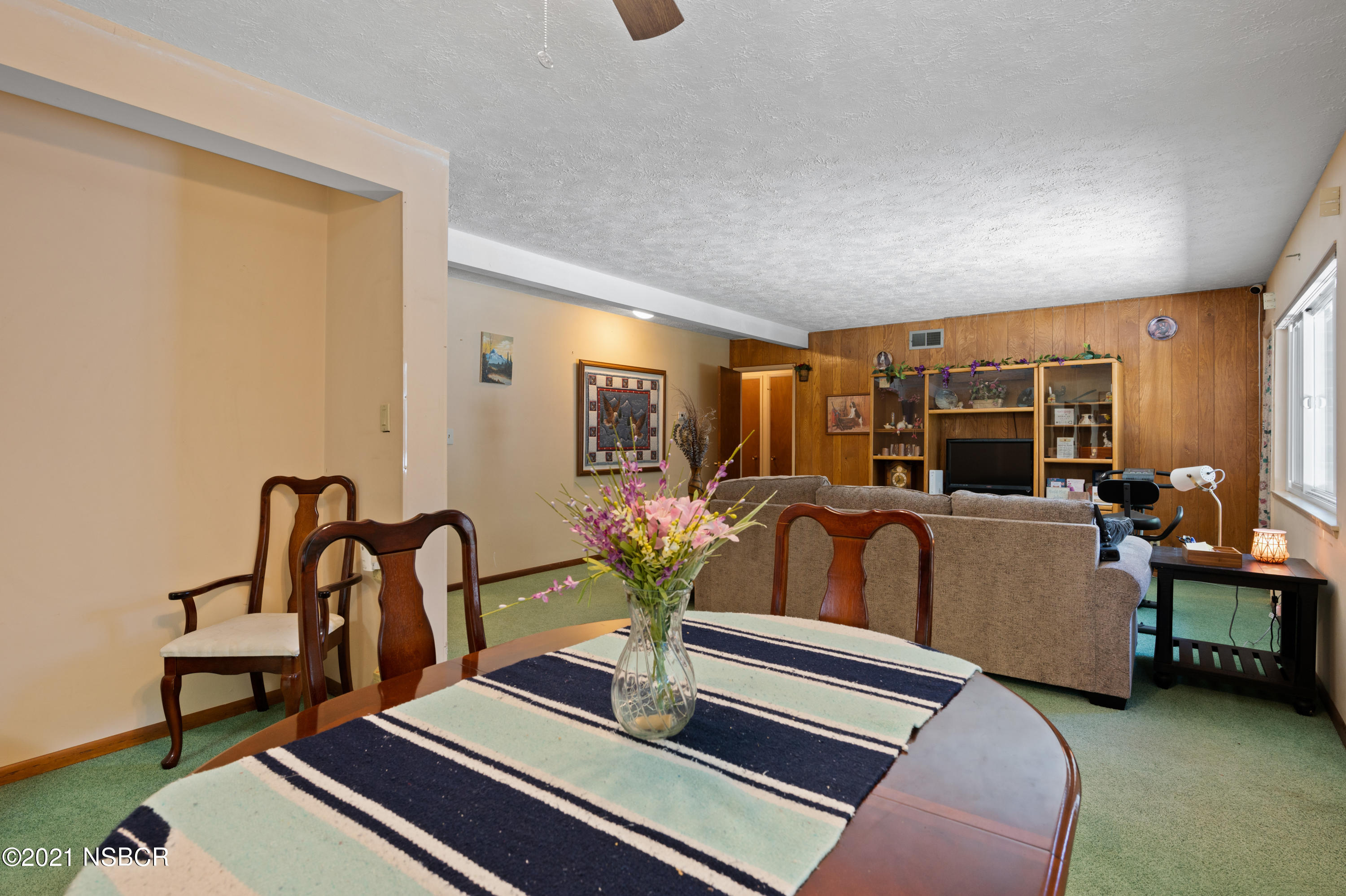 3432 Rucker Road Lompoc, CA 93436 - Photo 4 of 17 a living room with furniture gym equipment and a large window