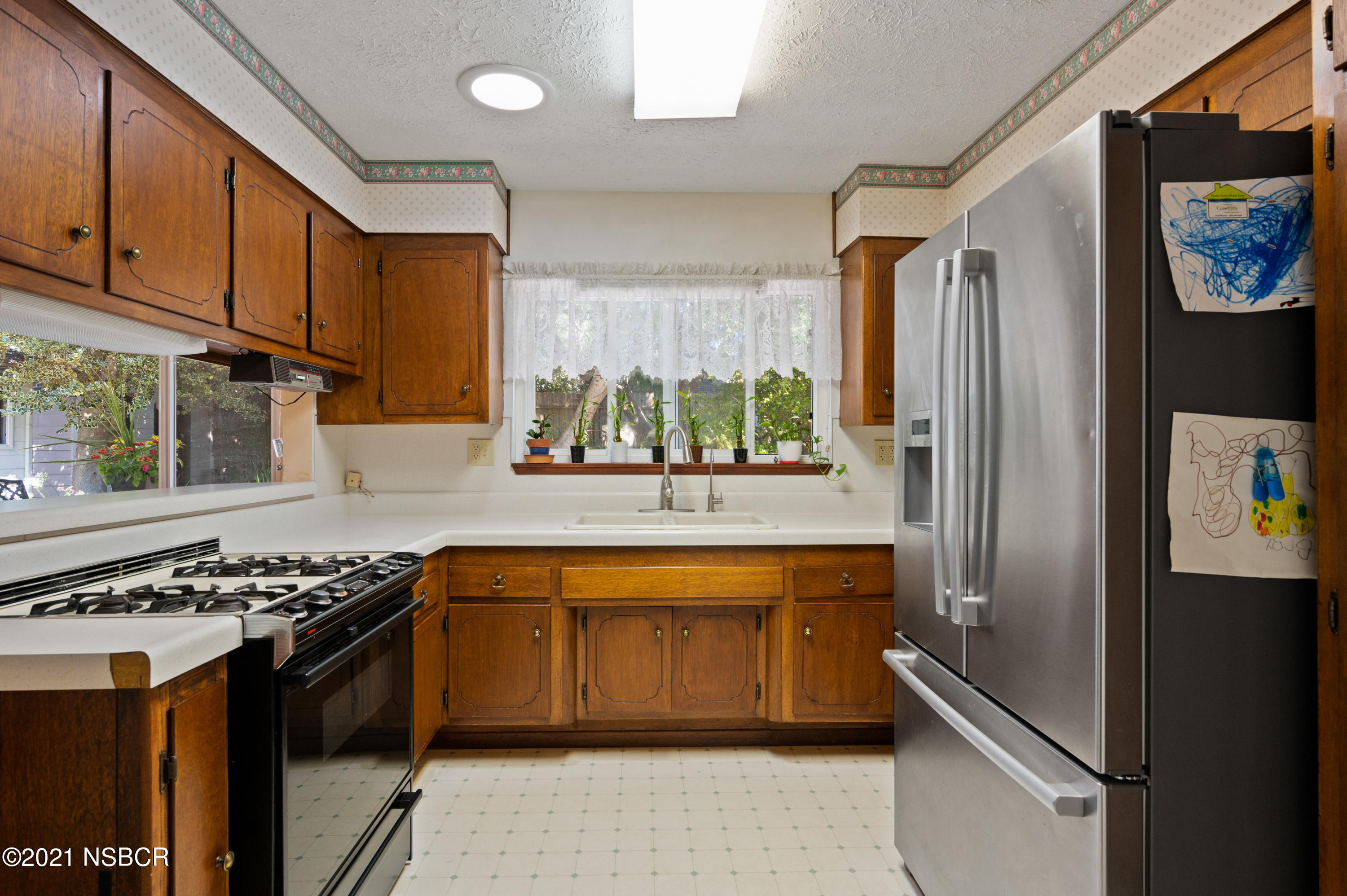 3432 Rucker Road Lompoc, CA 93436 - Photo 5 of 17 a kitchen with stainless steel appliances granite countertop a stove a sink and a refrigerator