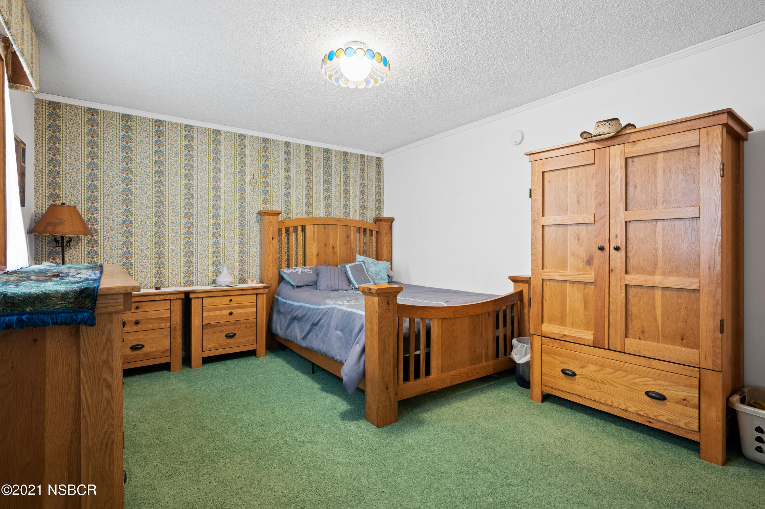 3432 Rucker Road Lompoc, CA 93436 - Photo 9 of 17 a bed room with a bed and a dresser