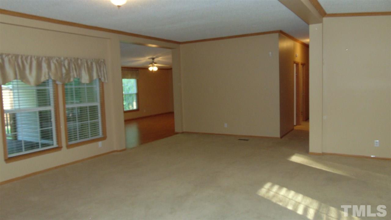 379 North Big Woods Road Spring Hope, NC 27882 - Photo 8 of 25 a view of an empty room with a fireplace