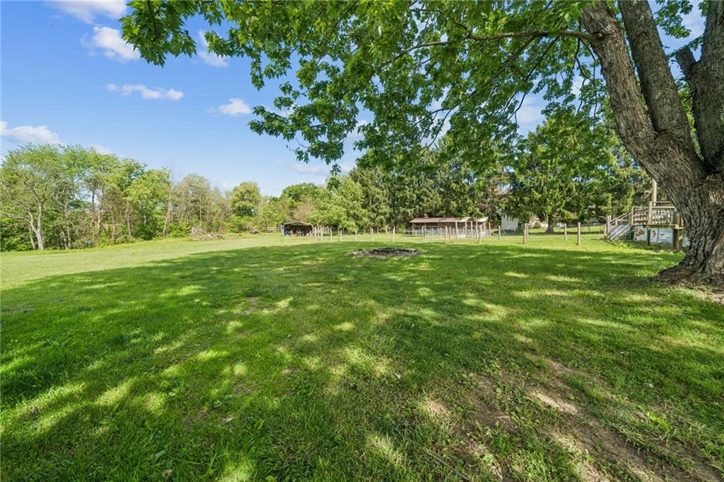 275 Adamik Road Clarksville, PA 15322 - Photo 37 of 39 a view of a grassy field with trees in the background