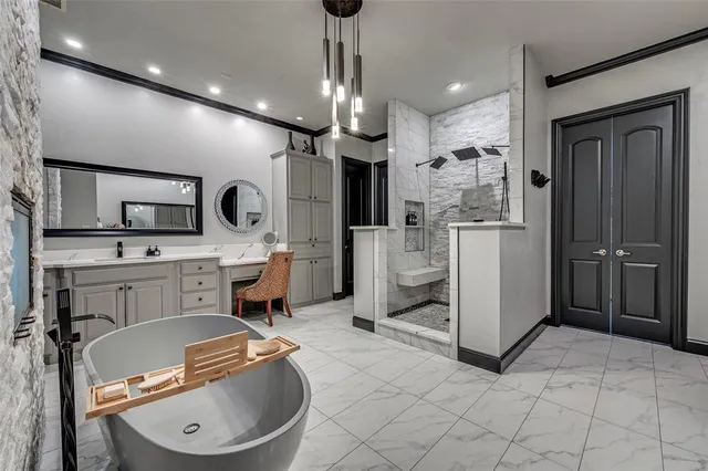 a kitchen with stainless steel appliances granite countertop a sink refrigerator and cabinets