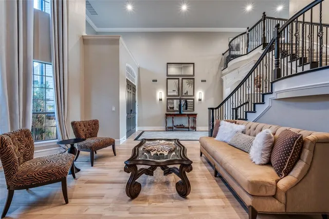 a living room with furniture rug and wooden floor