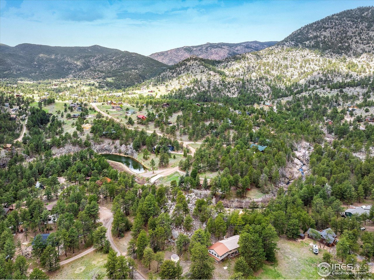 1289 Kiowa Road Lyons, CO 80540 - Photo 25 of 37 a view of a mountain range in a city