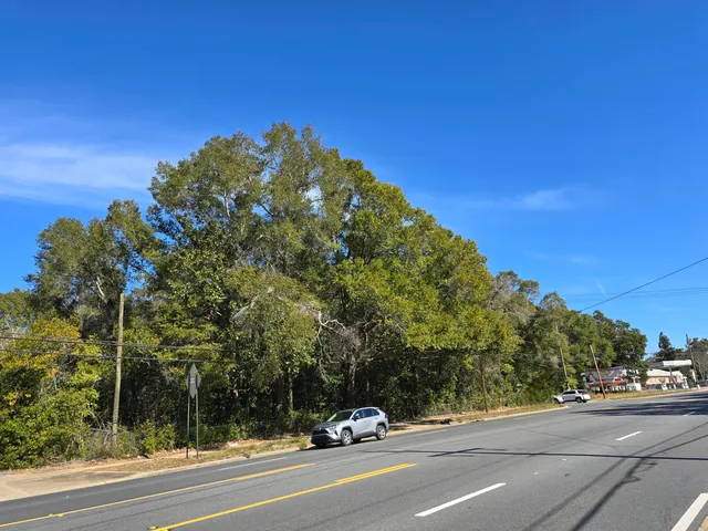 a view of a cars park on a road