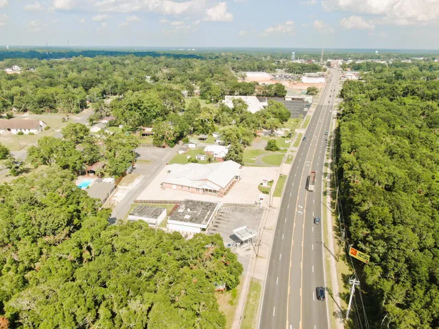an aerial view of residential houses with outdoor space