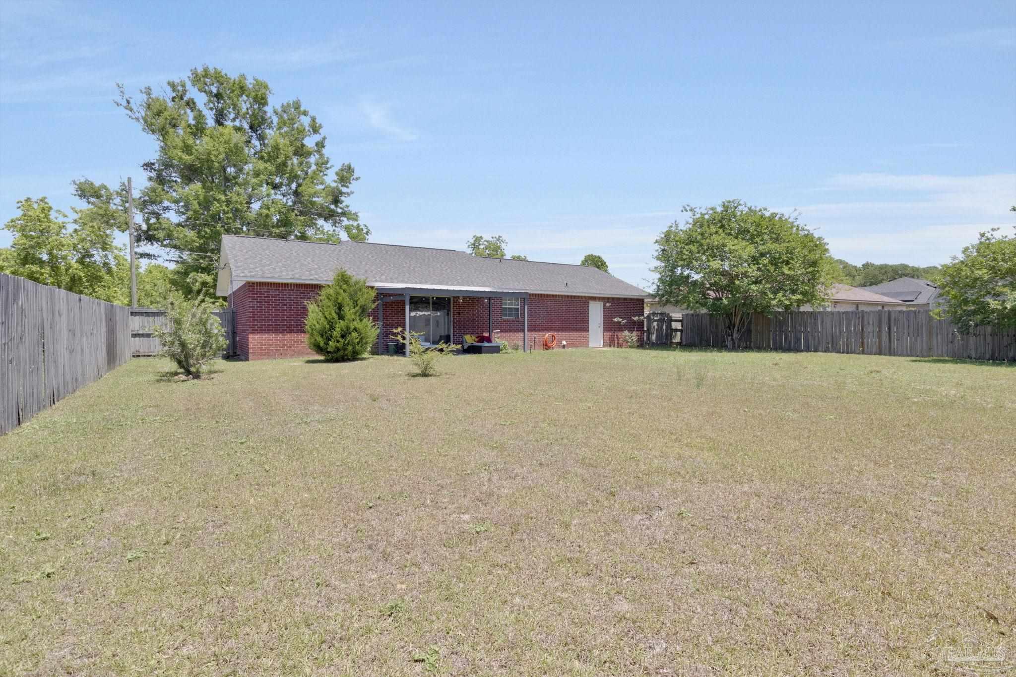 5539 Windrun Place Pace, FL 32571 - Photo 50 of 62 front view of a house with a yard