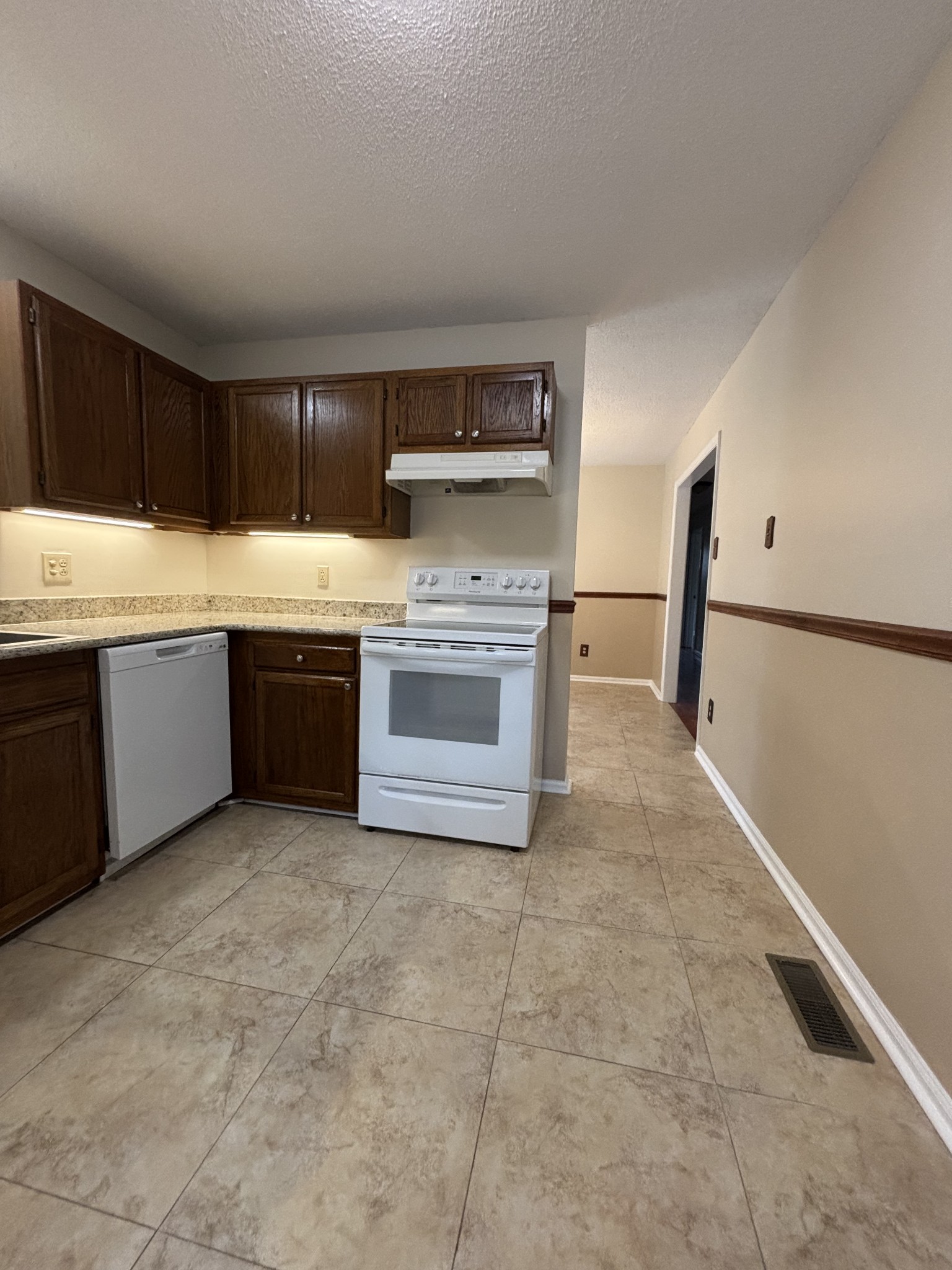 1830 Lowe Street Lewisburg, TN 37091 - Photo 12 of 22 a kitchen with stainless steel appliances granite countertop a sink and cabinets