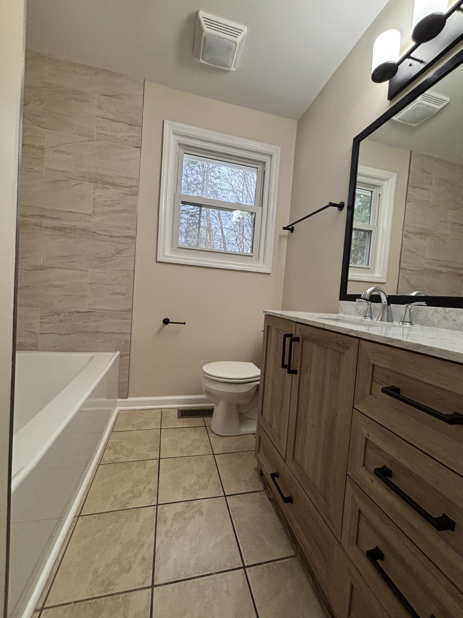 1830 Lowe Street Lewisburg, TN 37091 - Photo 15 of 22 a bathroom with a sink a toilet and bathtub