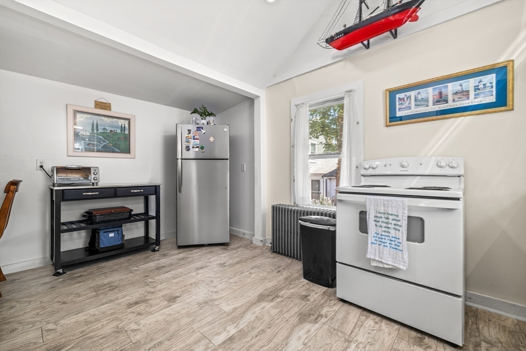 25 Union Avenue Wareham, MA 02558 - Photo 14 of 32 a kitchen with a stove top oven and refrigerator