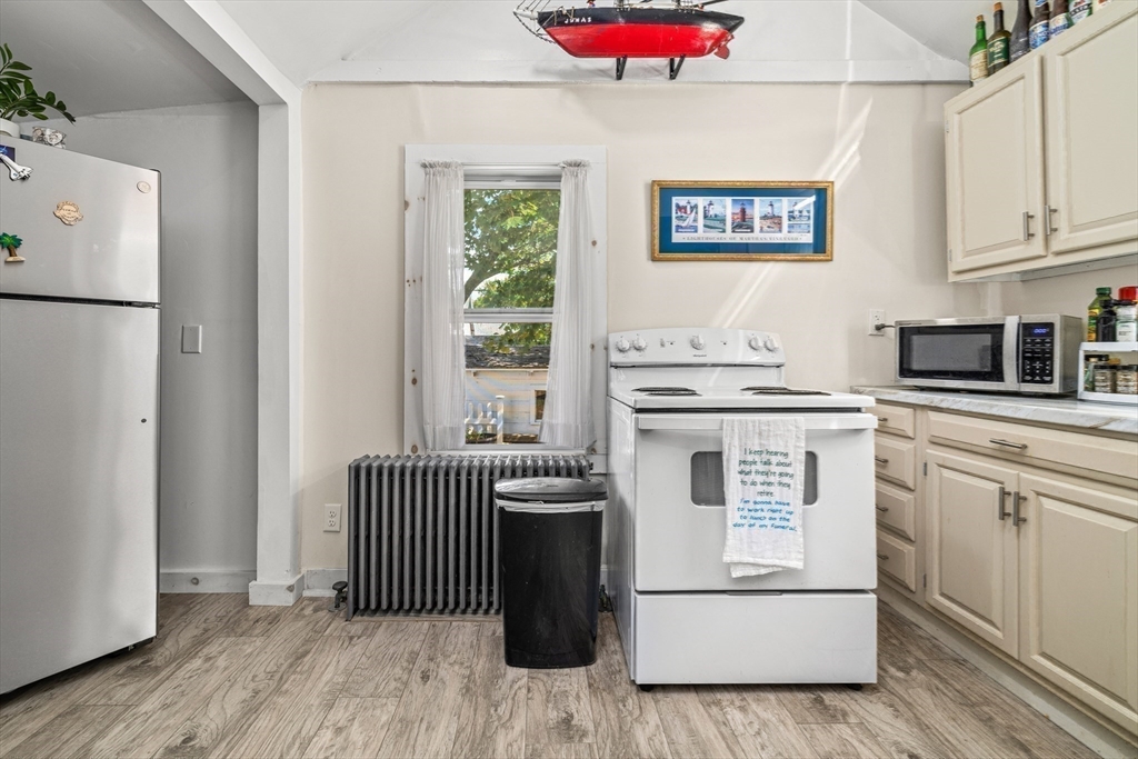 25 Union Avenue Wareham, MA 02558 - Photo 17 of 32 a kitchen with stainless steel appliances a refrigerator sink and cabinets