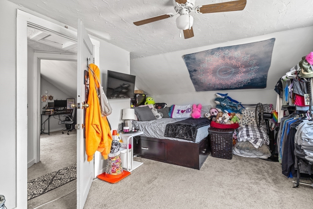 25 Union Avenue Wareham, MA 02558 - Photo 21 of 32 a bed room with a bed and a couch