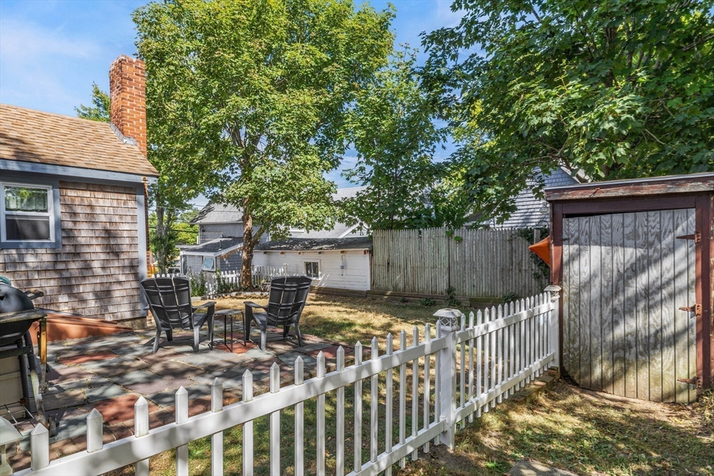 25 Union Avenue Wareham, MA 02558 - Photo 23 of 32 a view of a chair and table in backyard