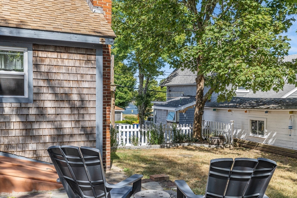 25 Union Avenue Wareham, MA 02558 - Photo 26 of 32 a view of a patio with table and chairs and potted plants