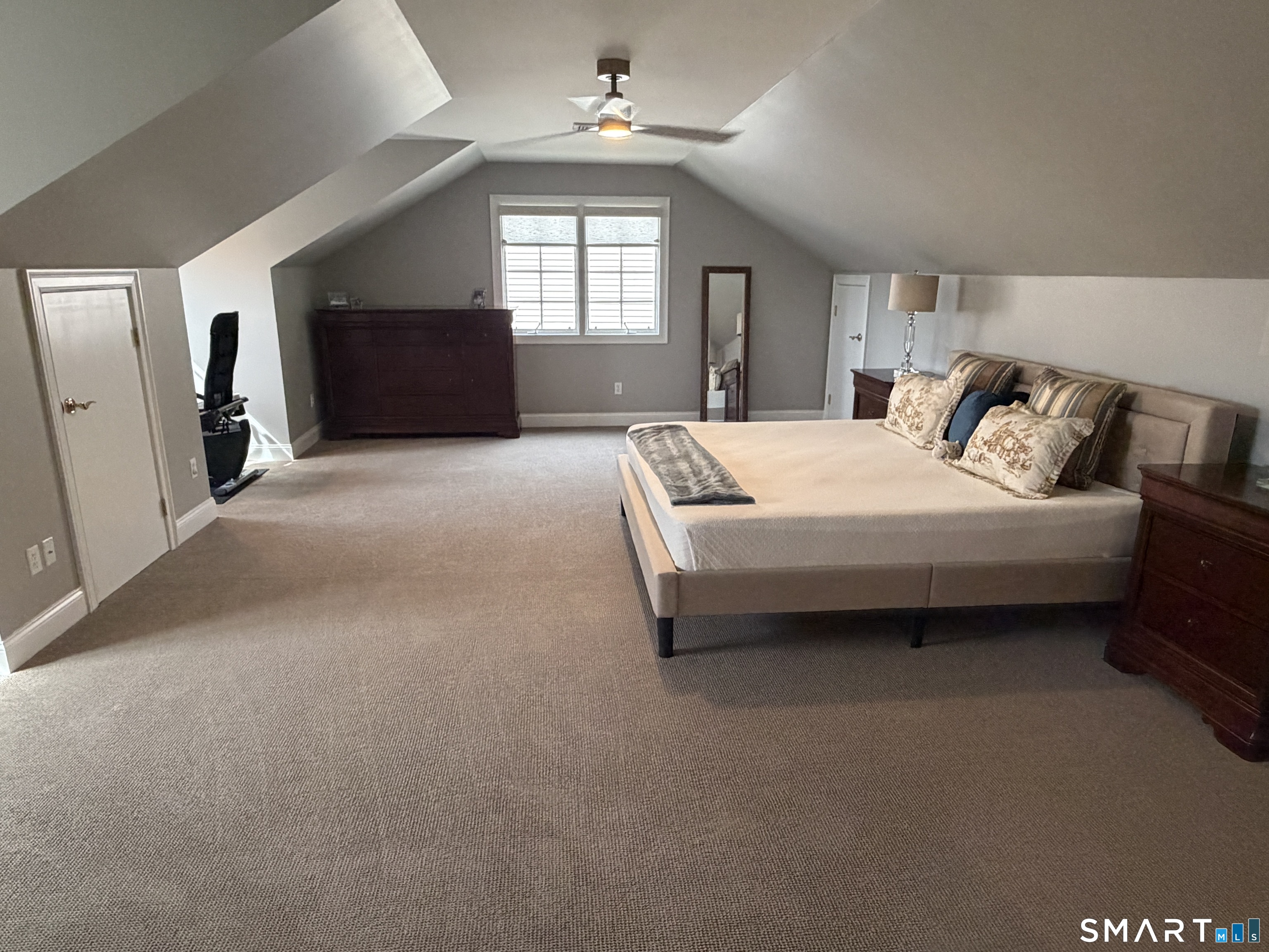6 Winding Way, Unit 6 Trumbull, CT 06611 - Photo 28 of 37 a spacious bedroom with a bed and a dresser next to a window