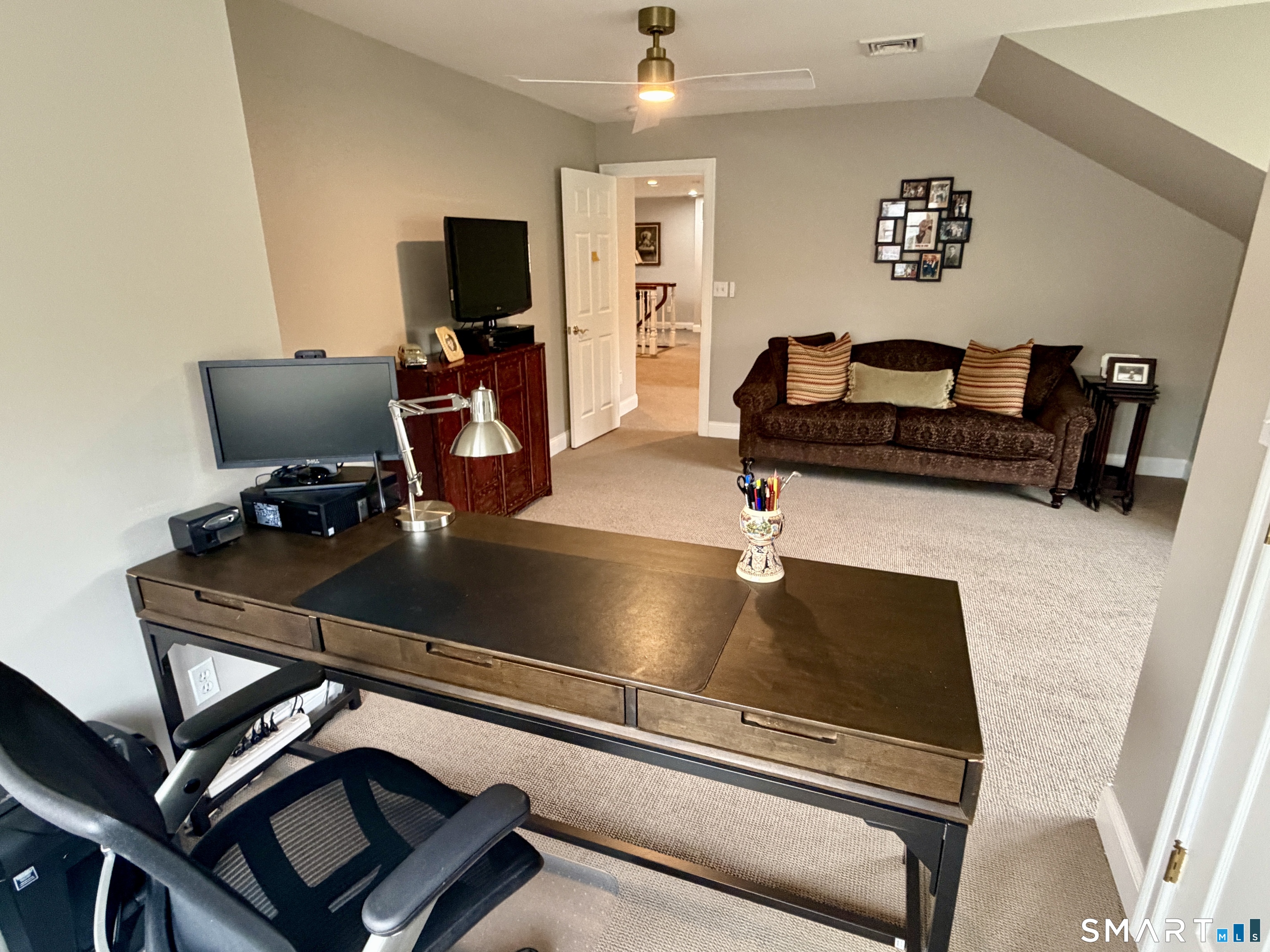 6 Winding Way, Unit 6 Trumbull, CT 06611 - Photo 29 of 37 a room with gym equipment and a flat screen tv