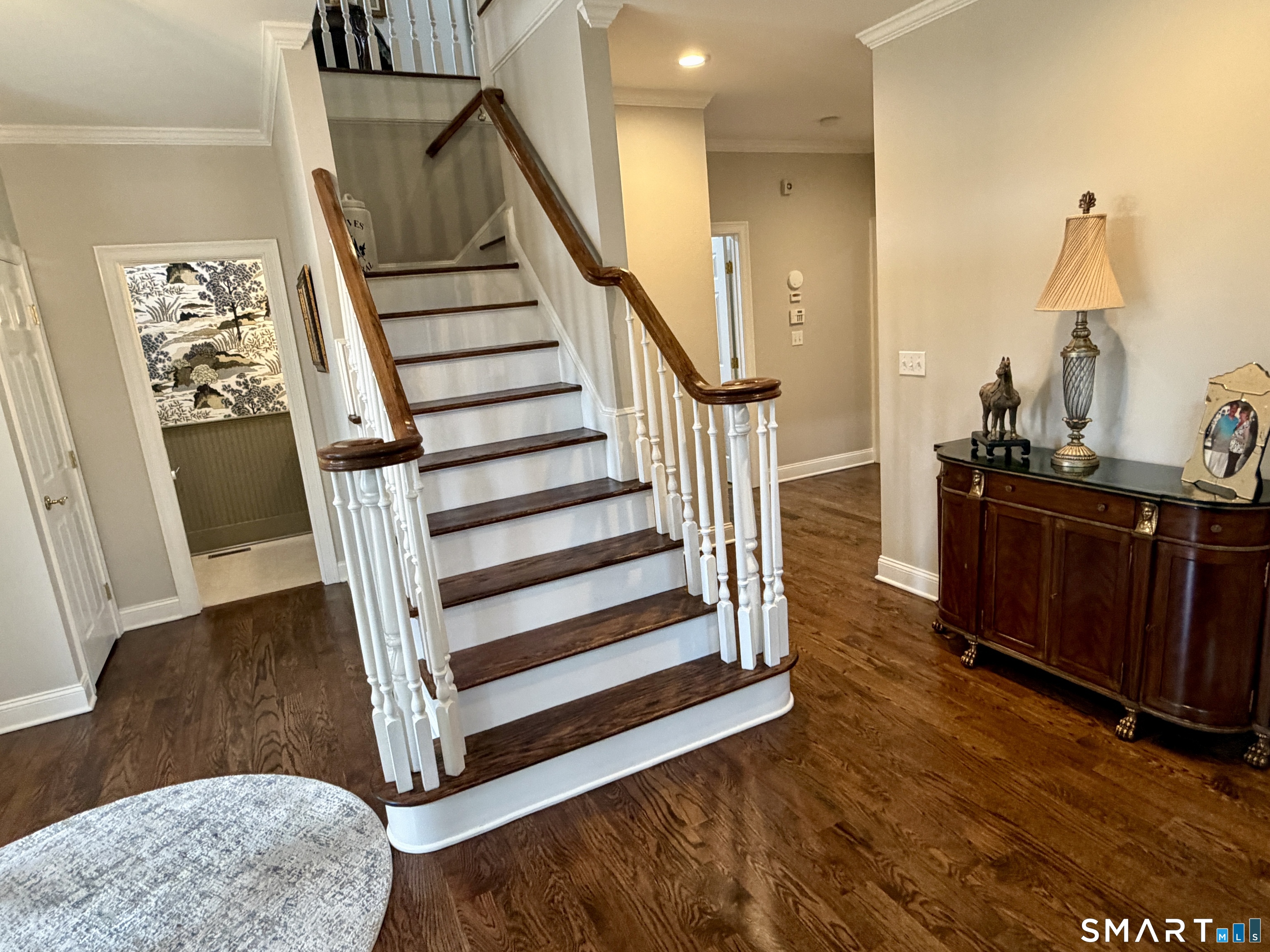 6 Winding Way, Unit 6 Trumbull, CT 06611 - Photo 3 of 37 a view of a hallway with wooden floor and staircase
