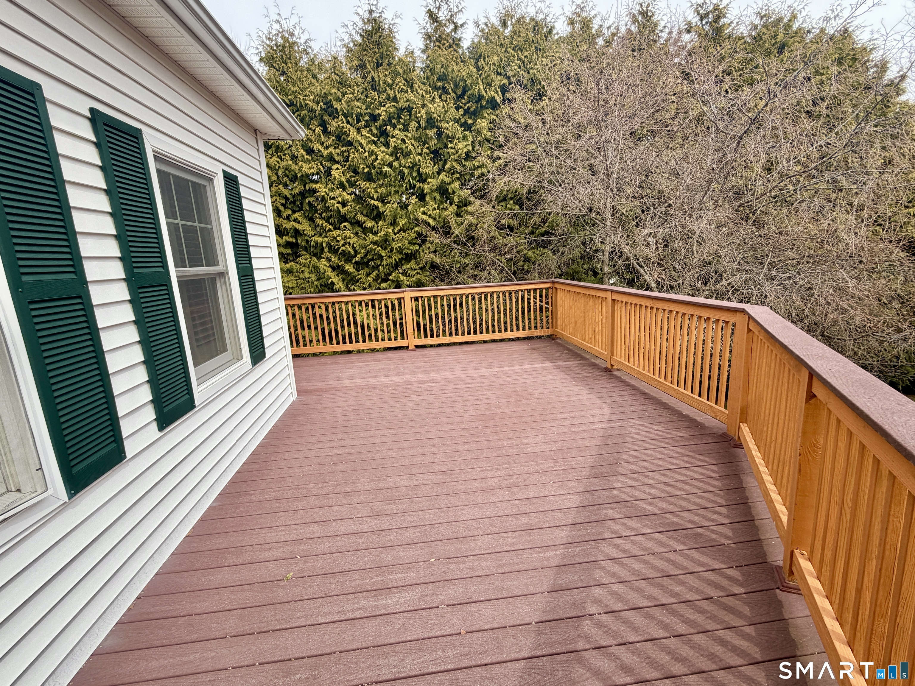 6 Winding Way, Unit 6 Trumbull, CT 06611 - Photo 33 of 37 a view of balcony with wooden floor and fence