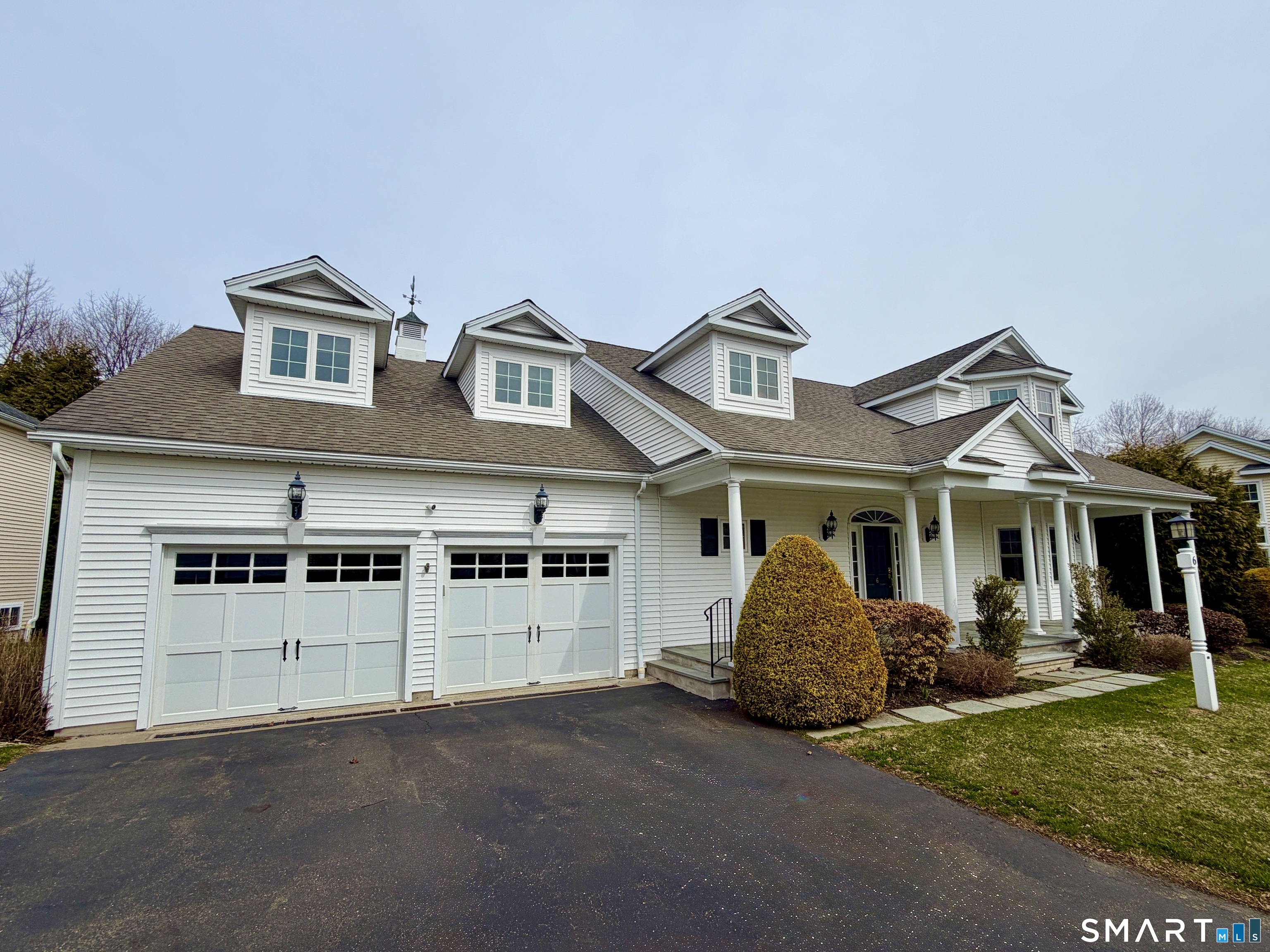 6 Winding Way, Unit 6 Trumbull, CT 06611 - Photo 36 of 37 a front view of a house with a yard and garage