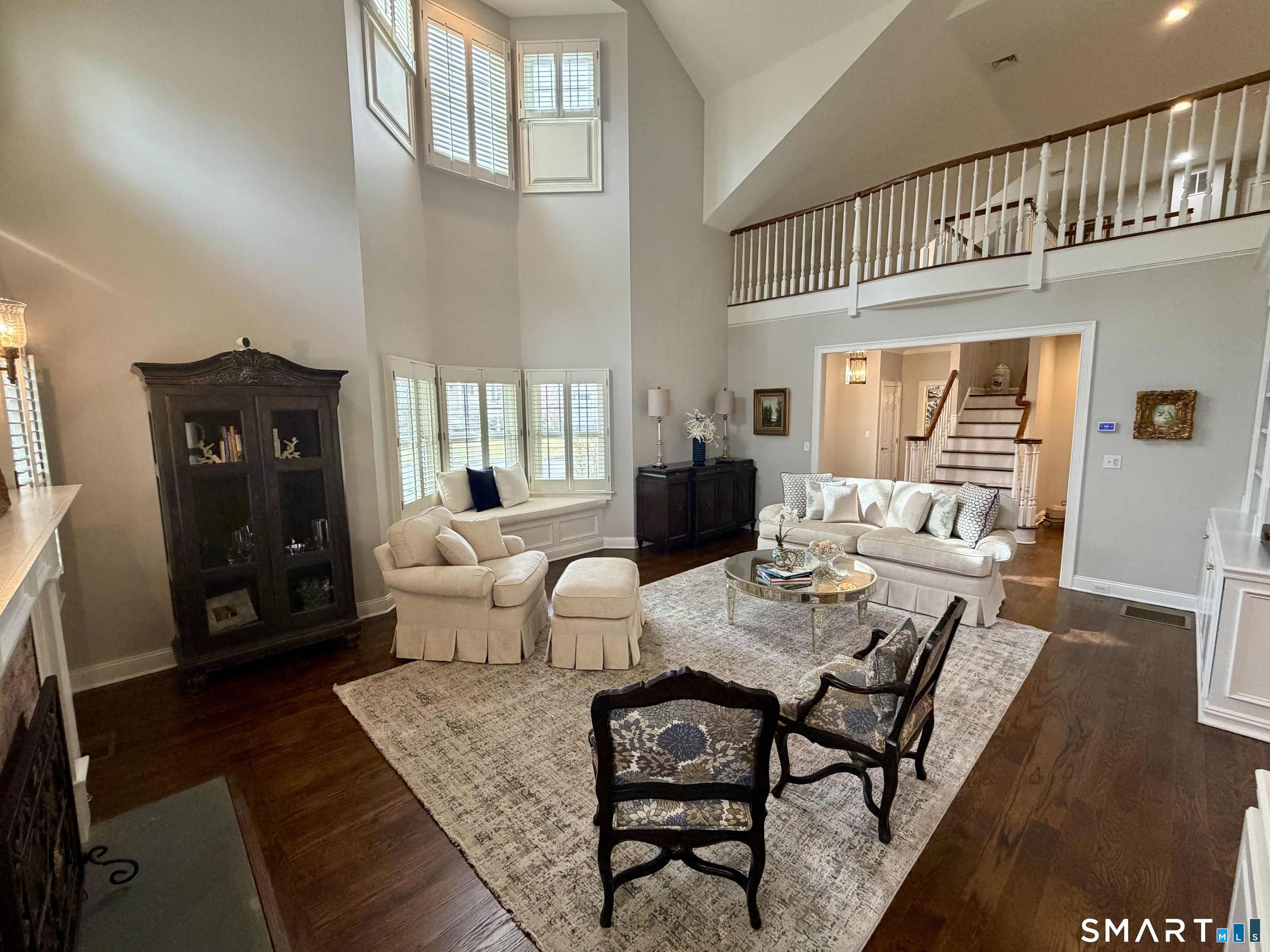 6 Winding Way, Unit 6 Trumbull, CT 06611 - Photo 6 of 37 a living room with furniture a fireplace and a large window