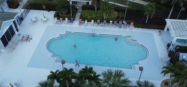 an aerial view of a house with outdoor space and sitting area