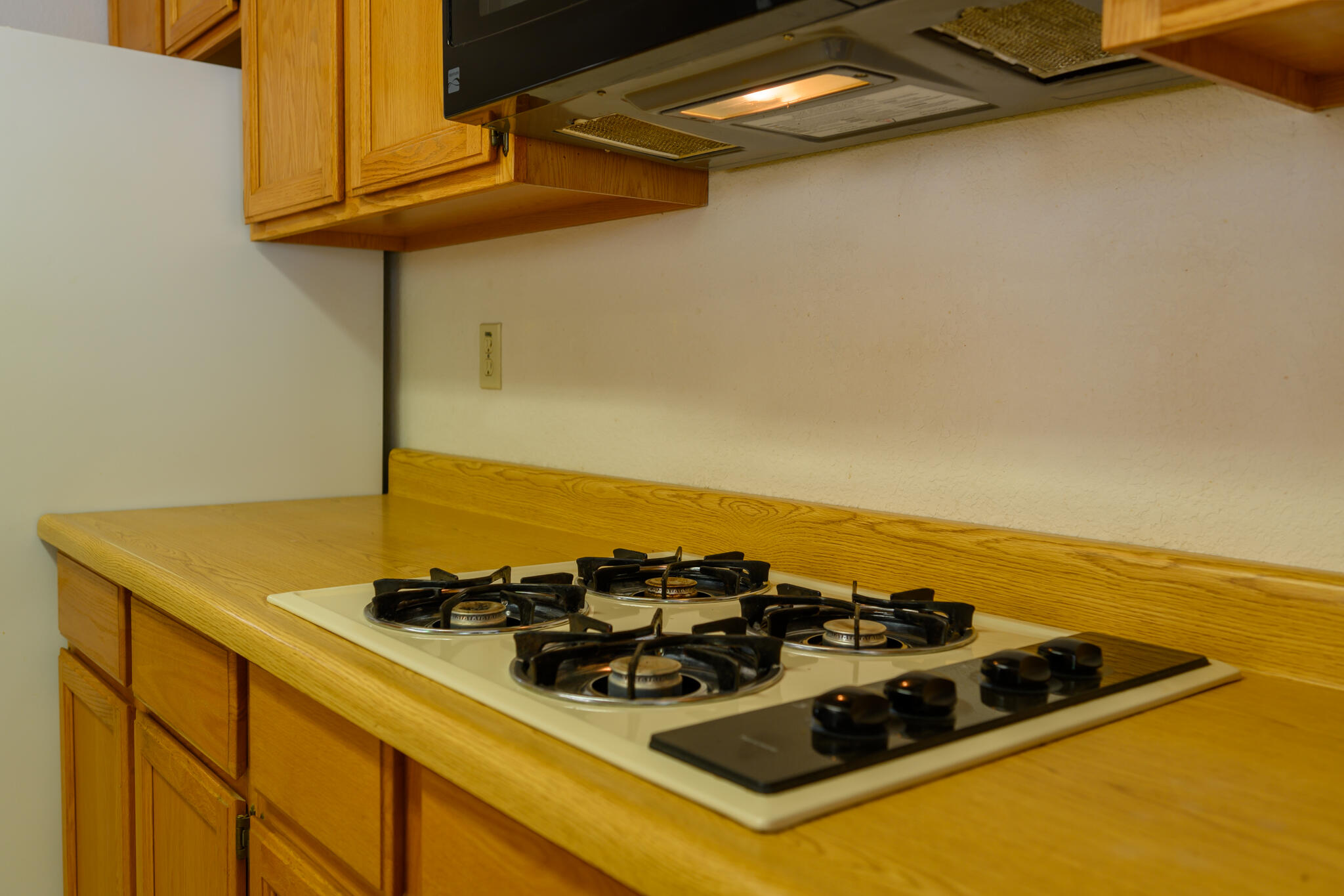 2307 Goose Ranch Road Lewiston, CA 96052 - Photo 20 of 37 a close up of a stove top oven sitting inside of a kitchen