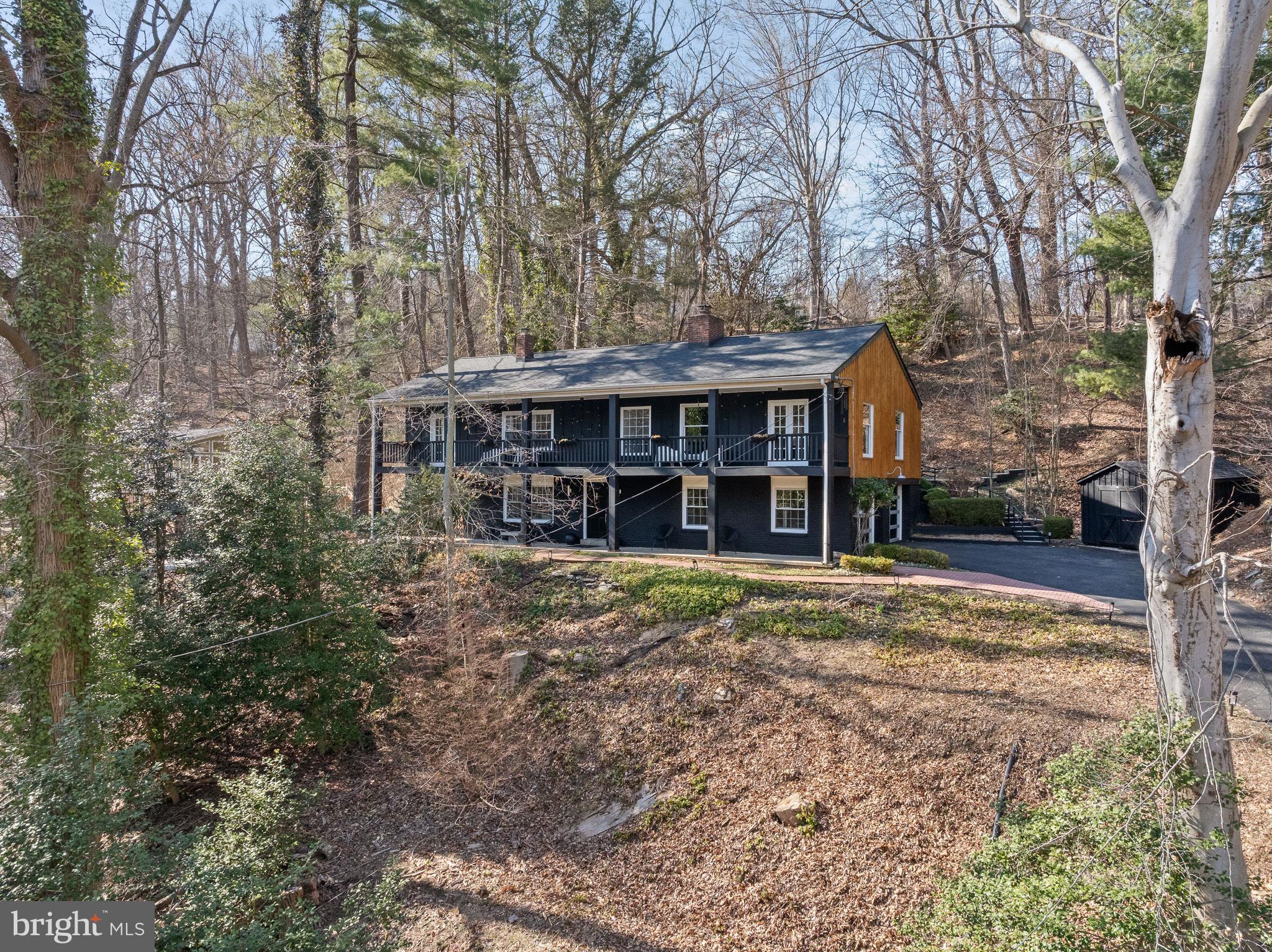 425 Oak Valley Road Media, PA 19063 - Photo 45 of 48 a view of a house with a yard and large trees