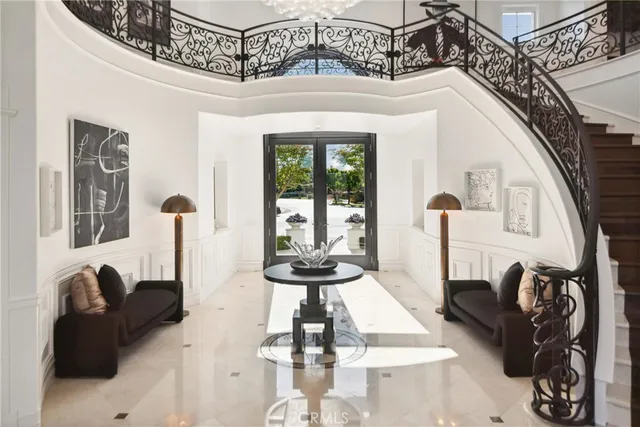 a kitchen with stainless steel appliances kitchen island granite countertop a stove top oven a sink dishwasher a dining table and chairs