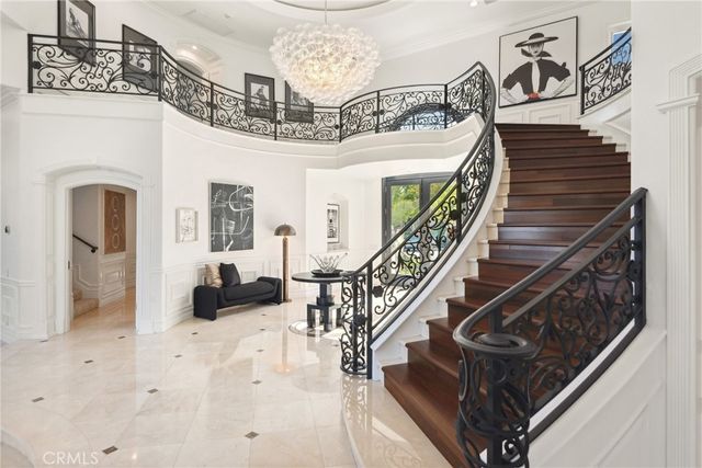 a spacious bedroom with furniture and a fireplace