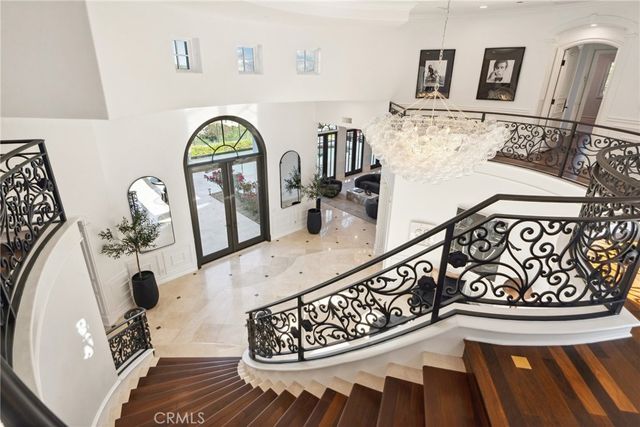 a bathroom with a tub a double vanity sink and a mirror