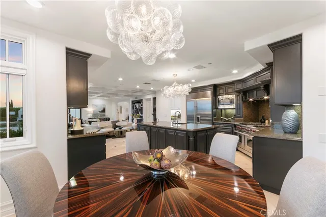 a utility room with sink dryer and washer