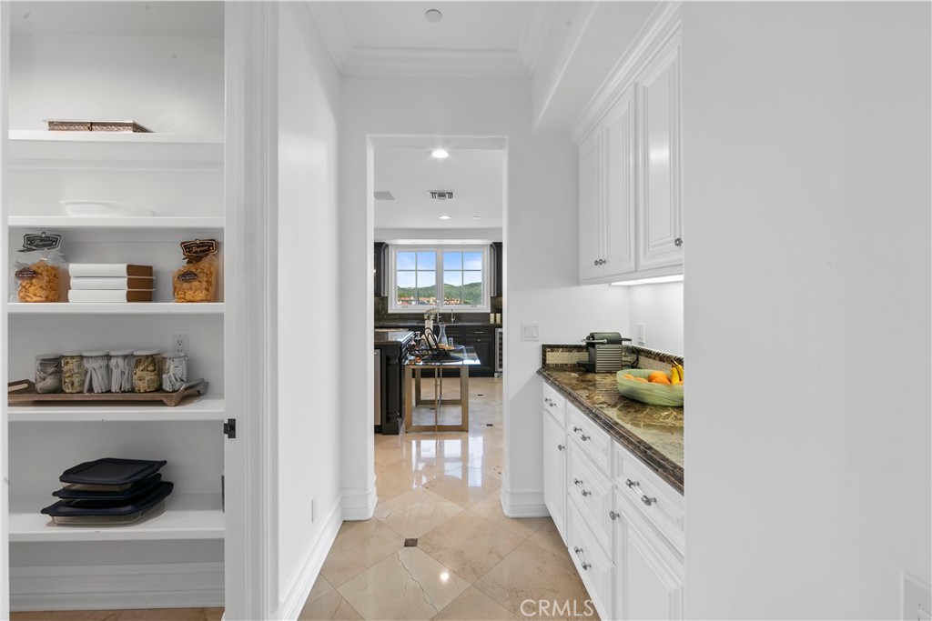 28 Shoreridge Newport Coast, CA 92657 - Photo 23 of 75 Walk-in pantry, butlers pantry with connection to formal litchen and dining room.