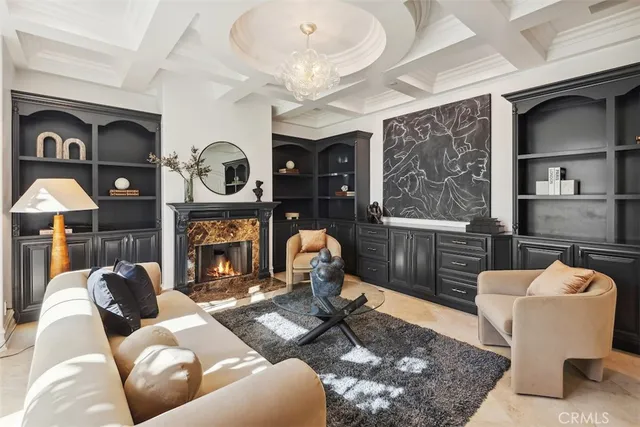 a living room with furniture and large windows