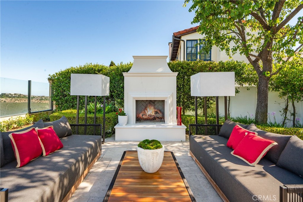 28 Shoreridge Newport Coast, CA 92657 - Photo 59 of 75 a view of a patio with couches chairs and a potted plant
