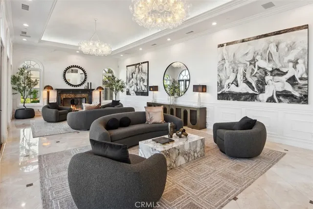 a view of living room with furniture and a wooden floor