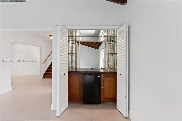 a view of a kitchen cabinets and a wooden floor