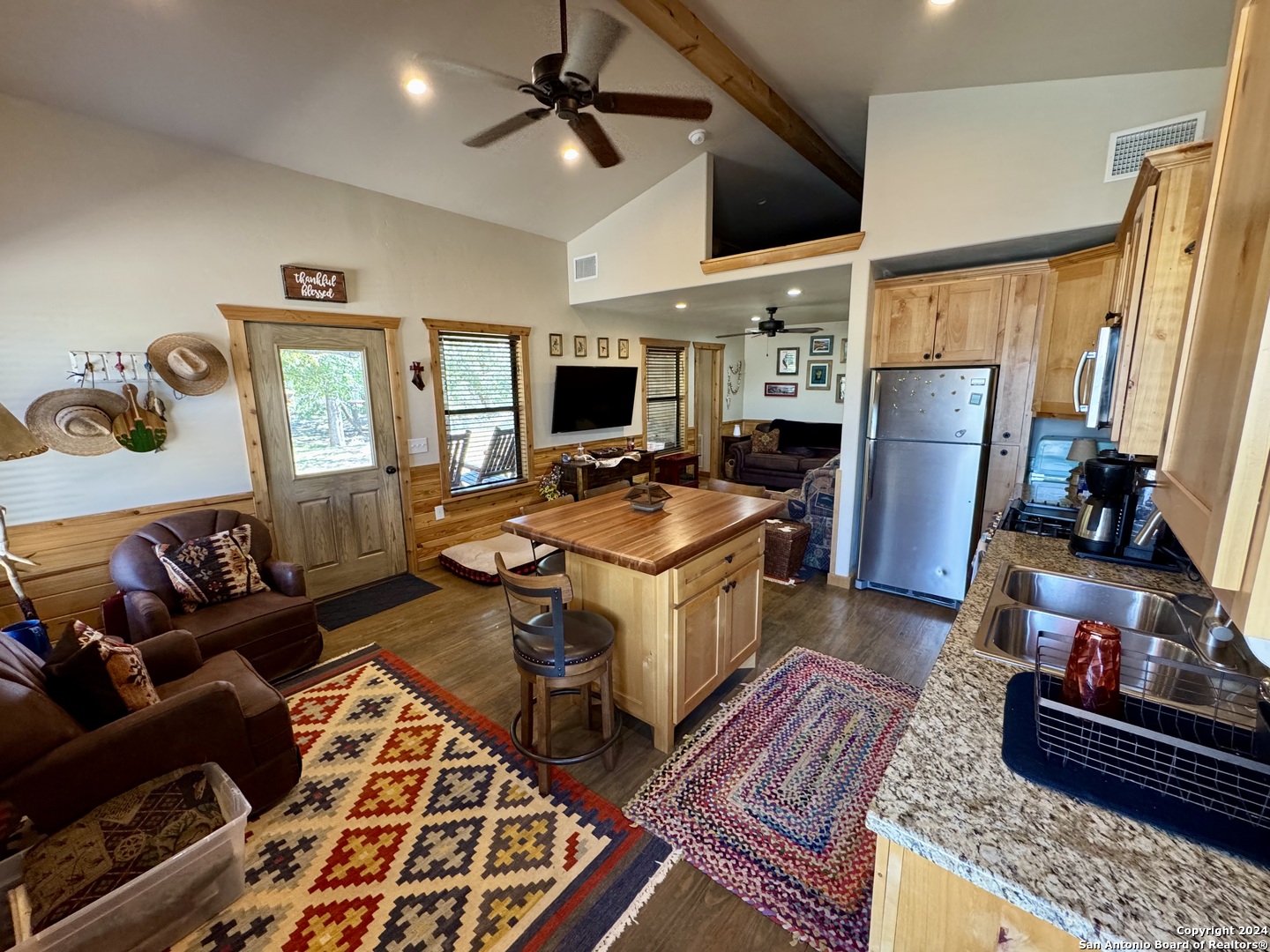 174 West 12 Mile Crossing Road Ingram, TX 78025 - Photo 11 of 13 a living room with furniture and a flat screen tv