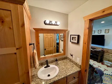 a bathroom with a sink and a mirror