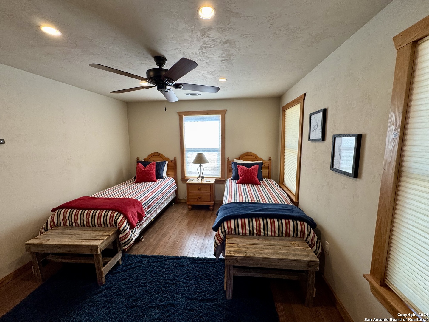174 West 12 Mile Crossing Road Ingram, TX 78025 - Photo 13 of 13 a living room with furniture a rug and a chandelier