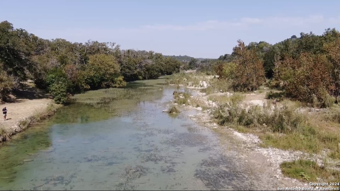 174 West 12 Mile Crossing Road Ingram, TX 78025 - Photo 2 of 13 a view of a lake with mountain