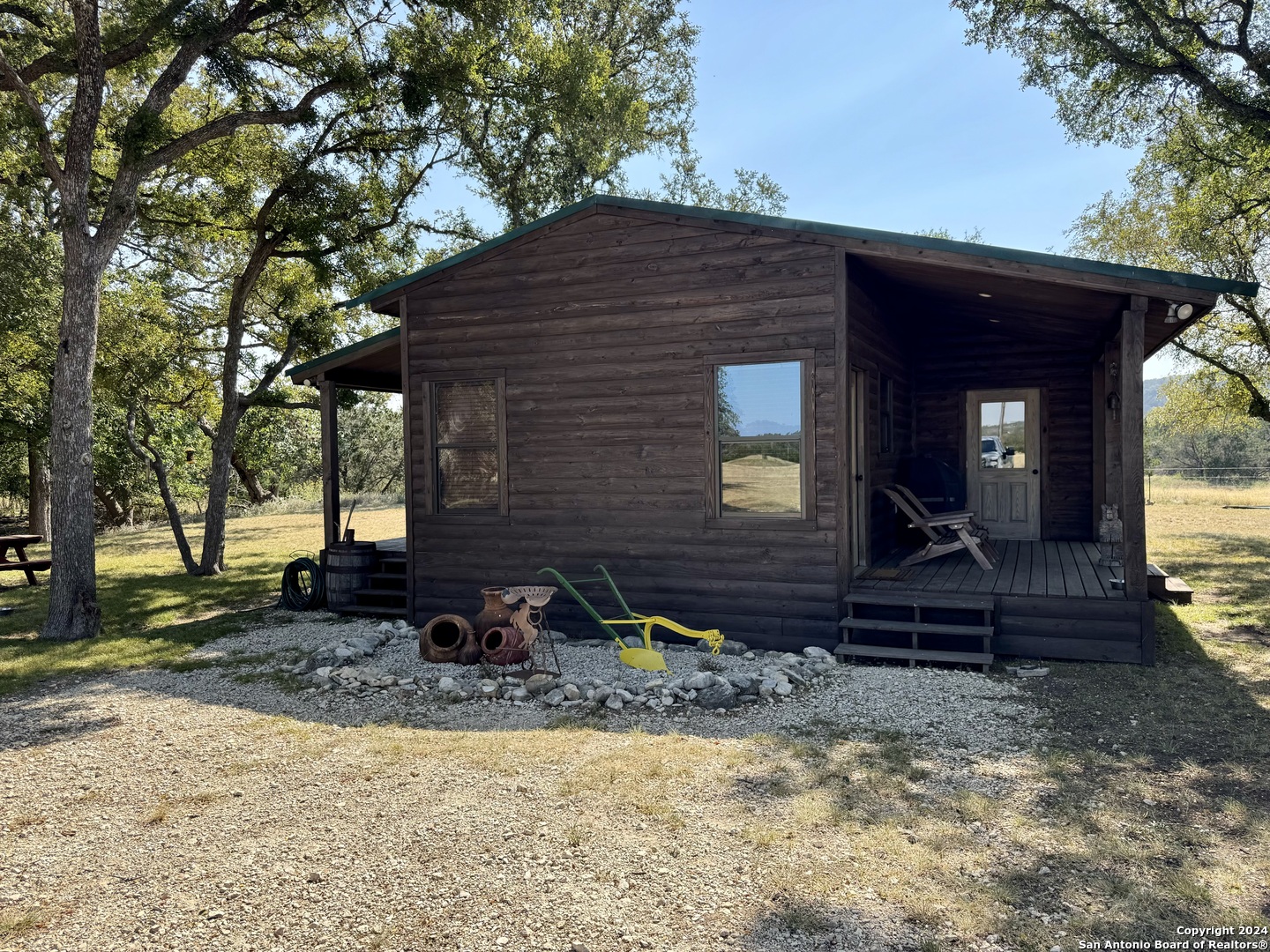 174 West 12 Mile Crossing Road Ingram, TX 78025 - Photo 6 of 13 a front view of a house with garden