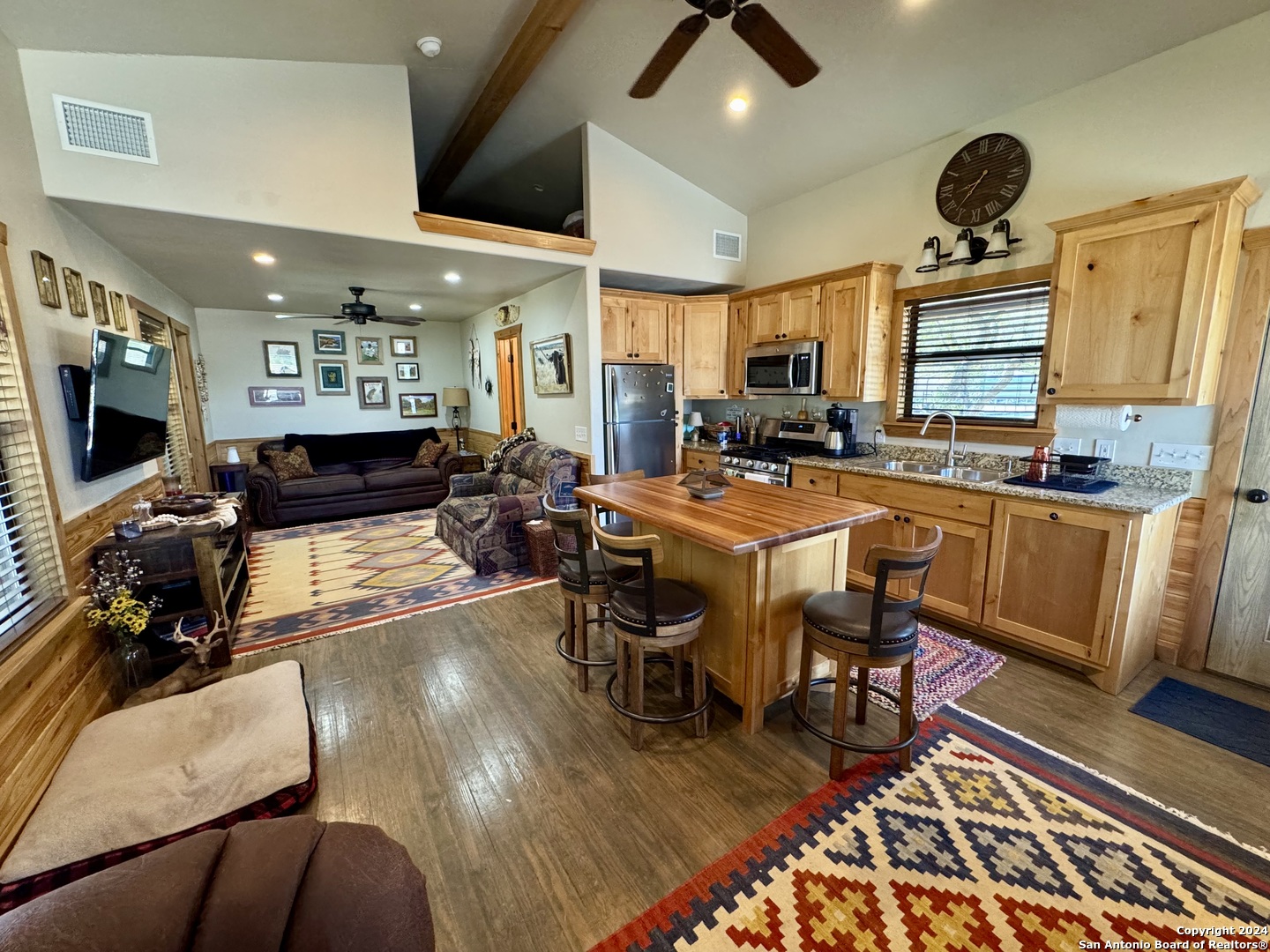 174 West 12 Mile Crossing Road Ingram, TX 78025 - Photo 10 of 13 a view of a dining room with furniture window and wooden floor