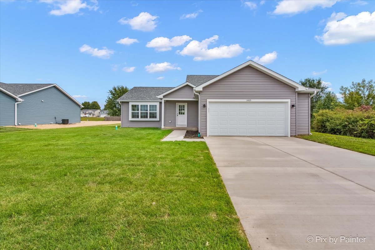 a front view of a house with yard
