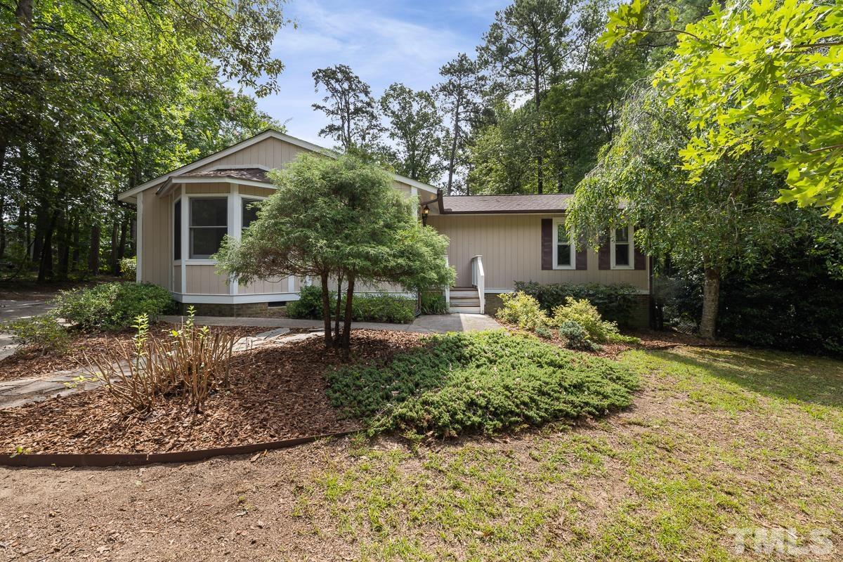 3604 Star Trek Court Raleigh, NC 27604 - Photo 2 of 24 a front view of a house with garden