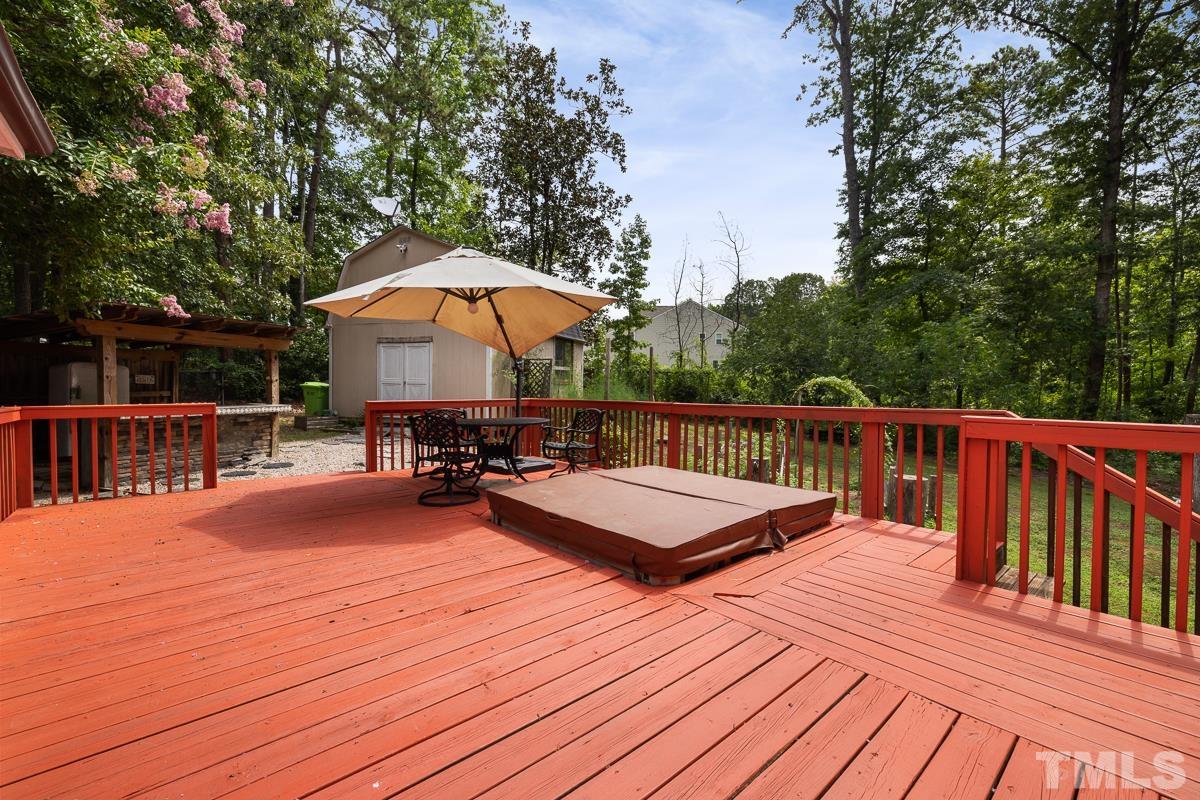 3604 Star Trek Court Raleigh, NC 27604 - Photo 21 of 24 a view of a deck with wooden floor and seating space