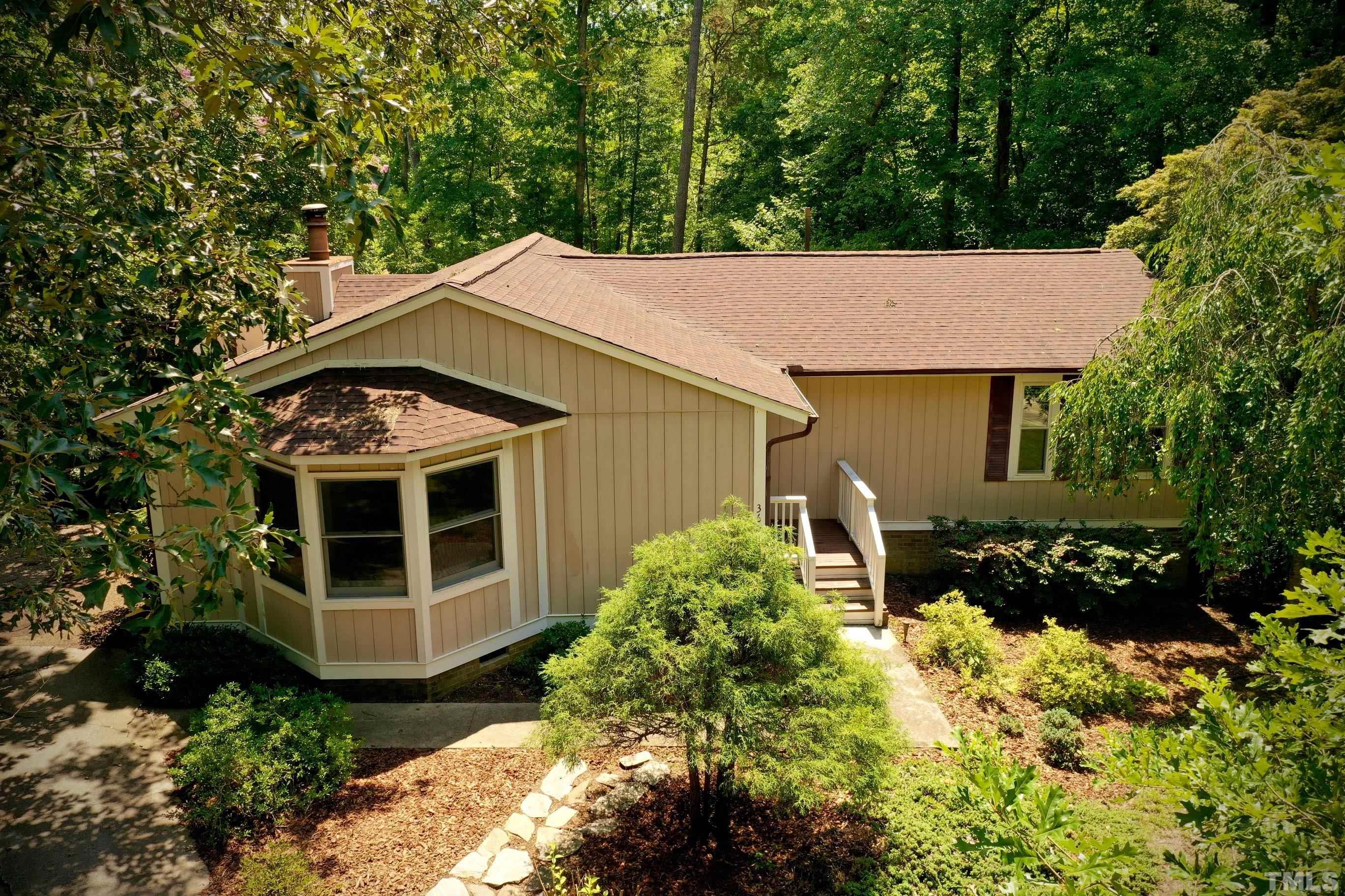 3604 Star Trek Court Raleigh, NC 27604 - Photo 23 of 24 a backyard of a house with lots of green space