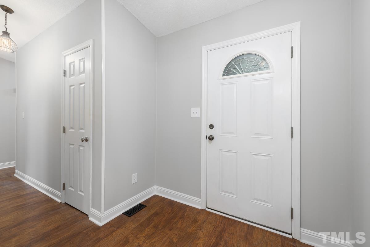 3604 Star Trek Court Raleigh, NC 27604 - Photo 3 of 24 a view of a hallway with wooden floor